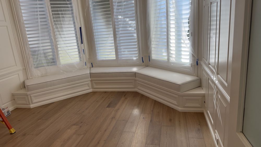 Custom upholstered bay window bench cushions in cream fabric