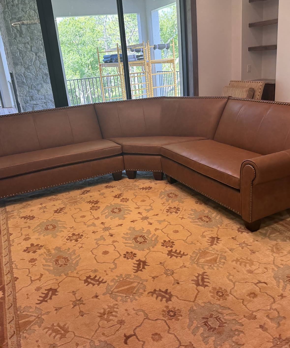 Custom cognac leather sectional with nailhead trim